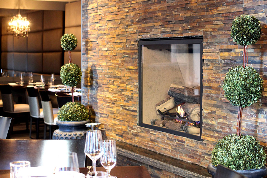The dining room fireplace at Deuxave
