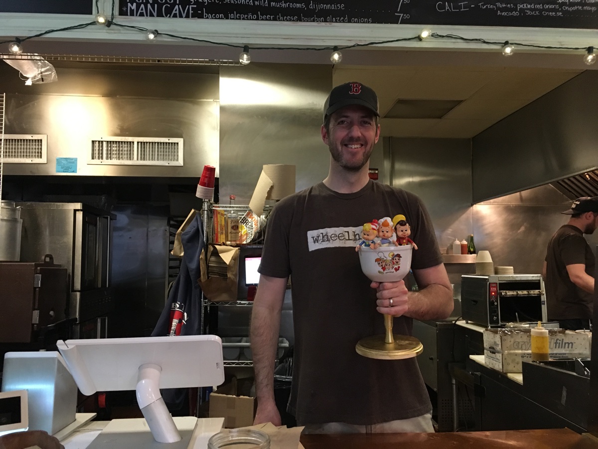 Jon Chase poses with his exclusive Starch Madness 2017 Snap, Crackle & Pop trophy at Wheelhouse