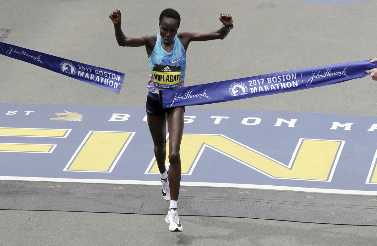 Edna Kiplagat, of Kenya, wins the women's division of the 121st Boston Marathon on Monday, April 17, 2017, in Boston. (AP Photo/Charles Krupa)