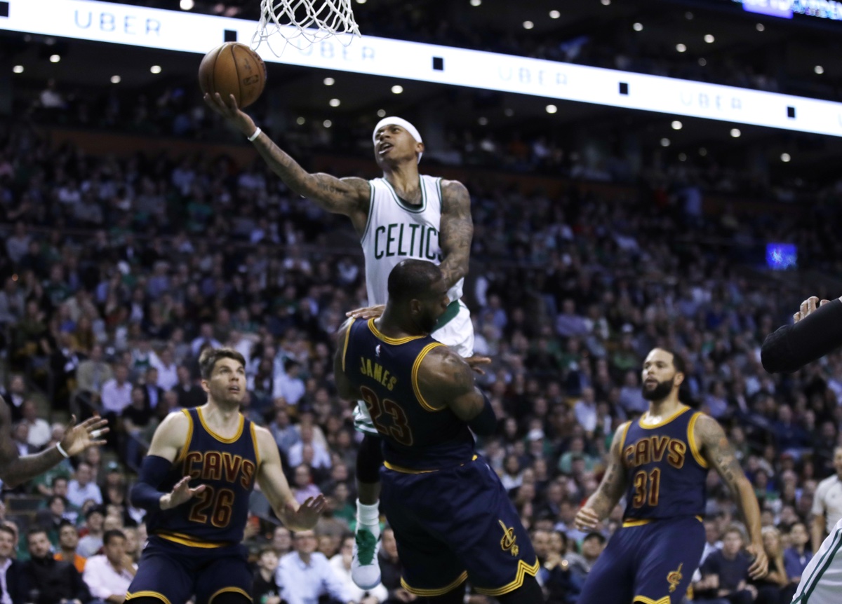 Boston Celtics guard Isaiah Thomas, top, collides with Cleveland Cavaliers forward LeBron James during the fourth quarter of an NBA basketball game in Boston, Wednesday, March 1, 2017. The Celtics defeated the Cavaliers 103-99