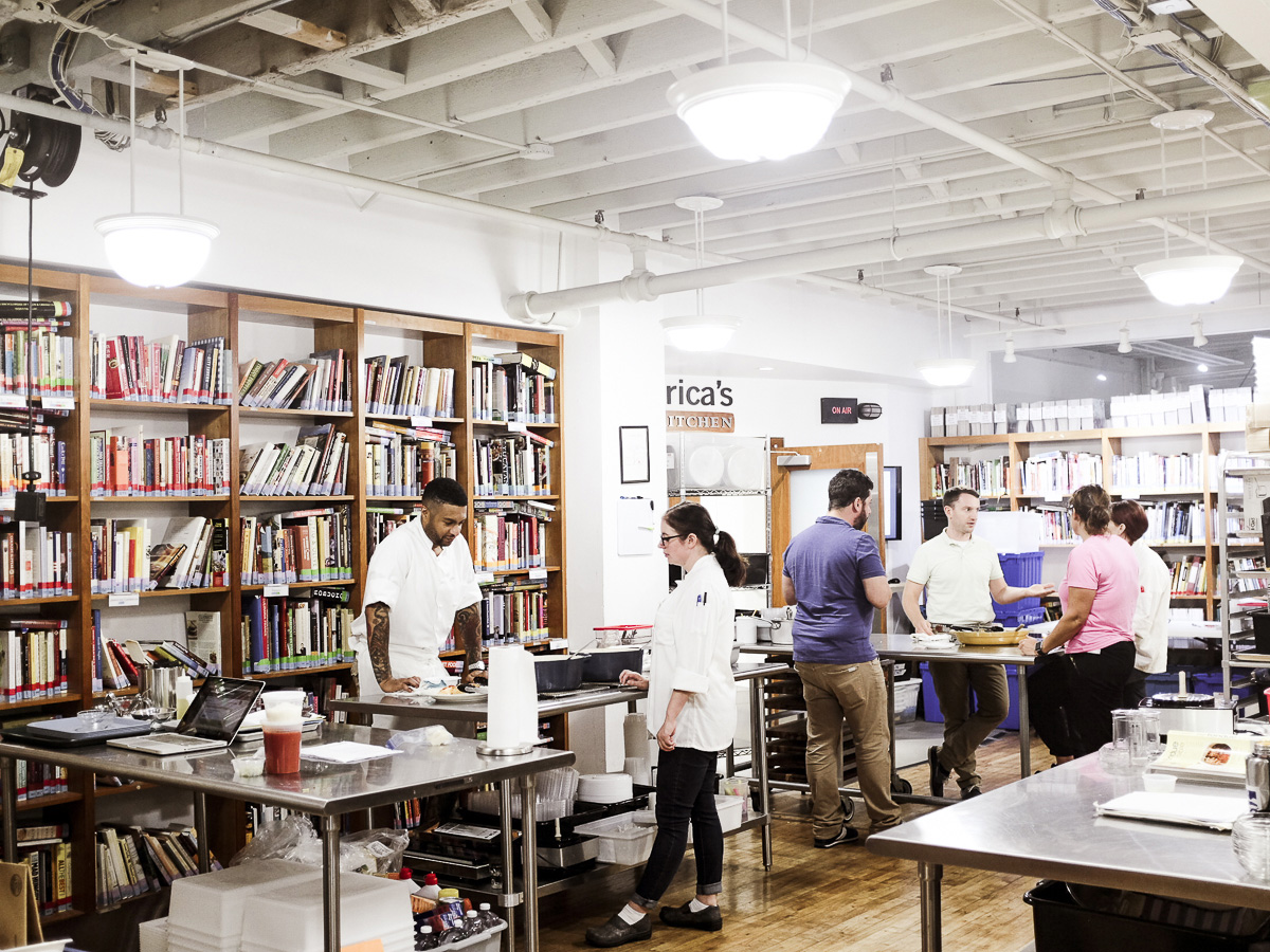 Employees meet and test recipes in the library at America's Test Kitchen in Brookline Village
