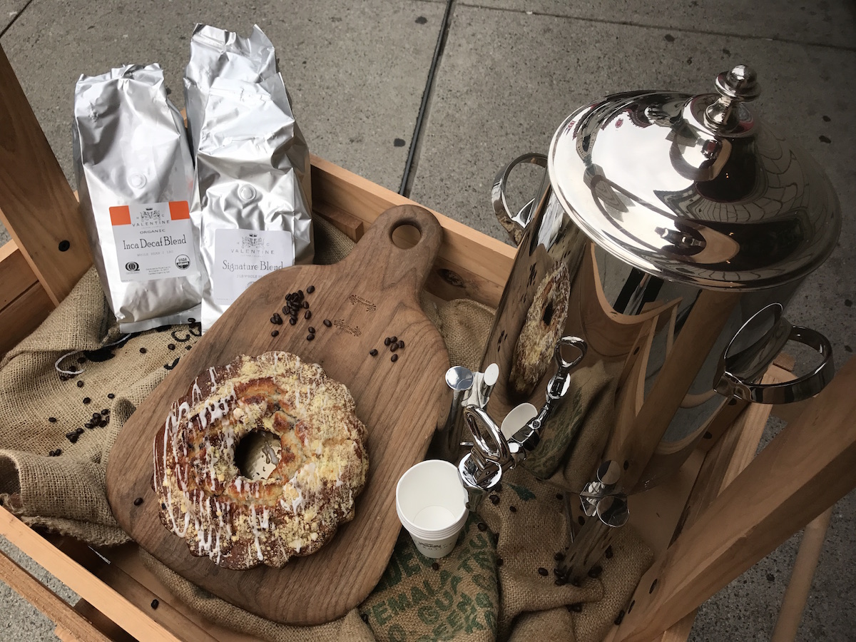 A cart with coffee and donuts outside Fairmont Copley Plaza