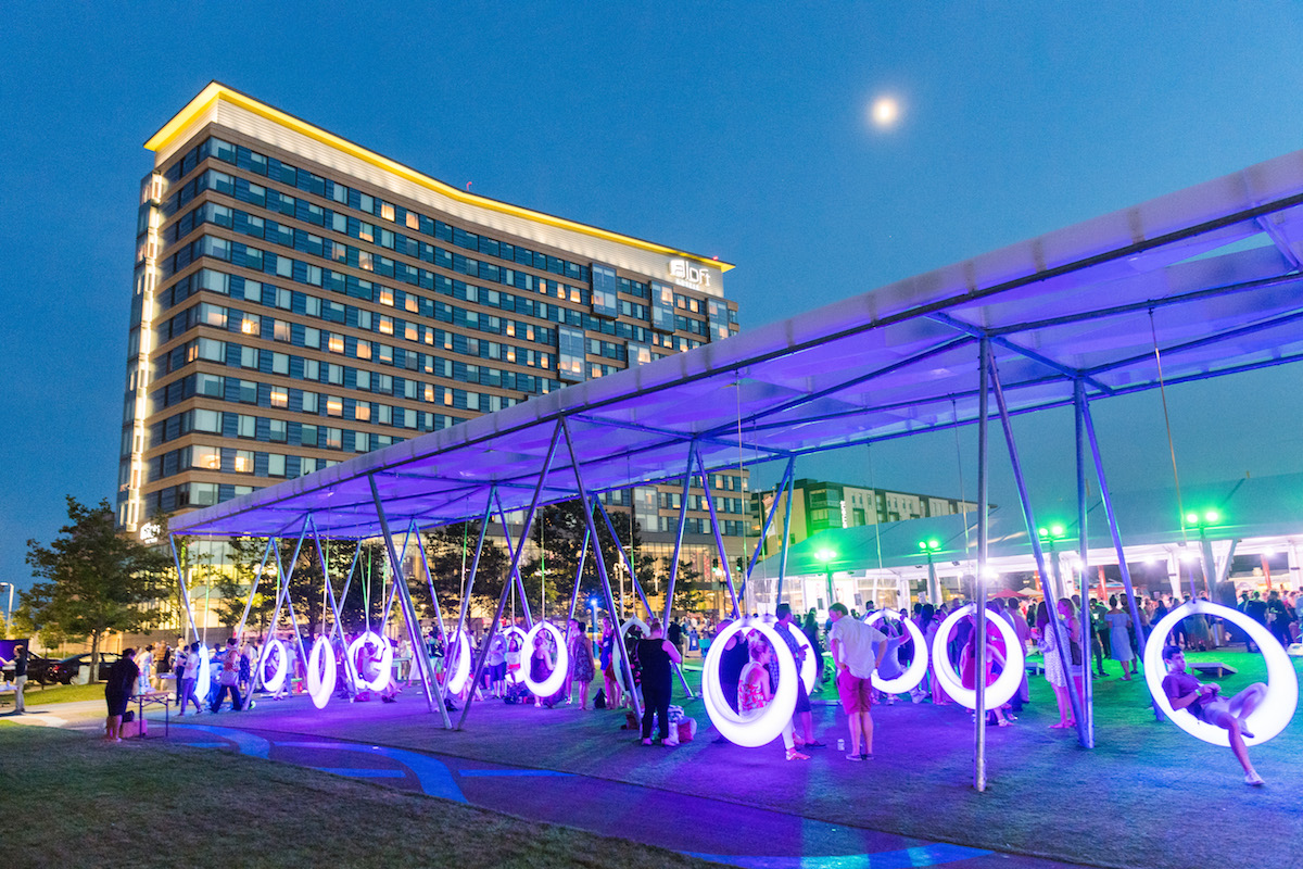 Circular swings on the Lawn on D lit up at night