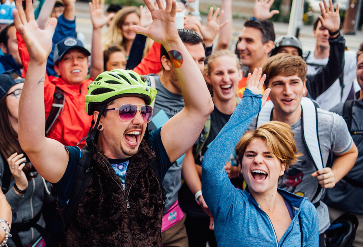 Athletes throw their hands in the air before the SF Hunt