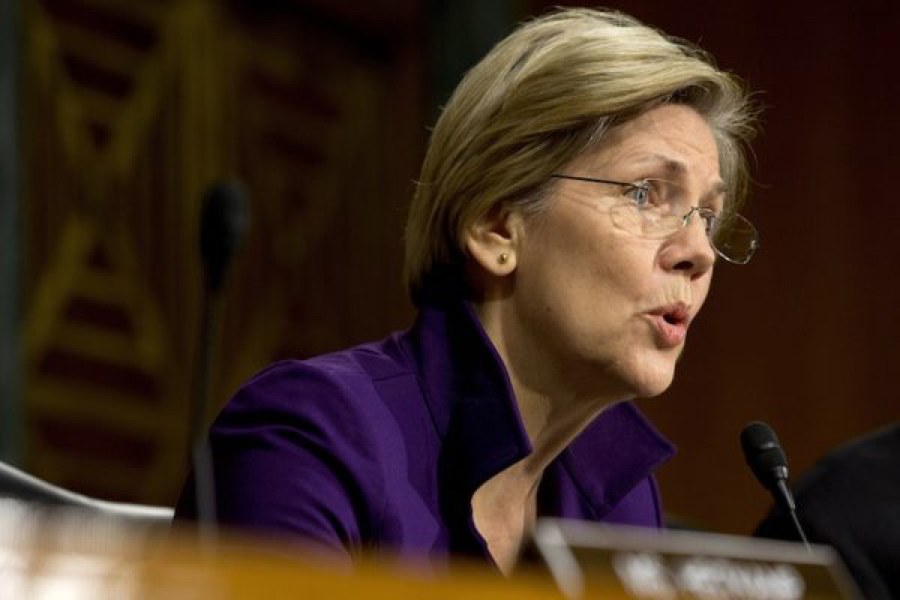 Elizabeth Warren at a microphone