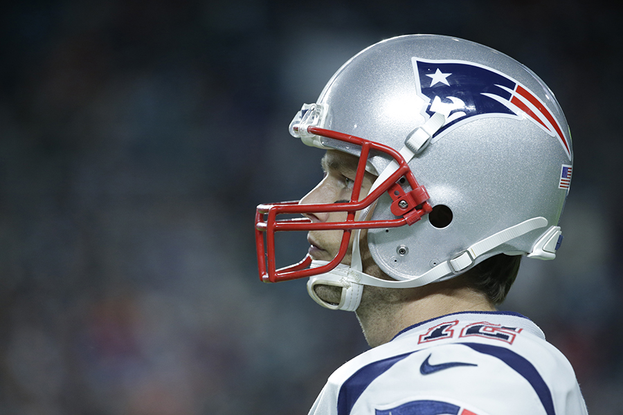 Tom Brady's profile as he gazes at the field in his Patriots helmet