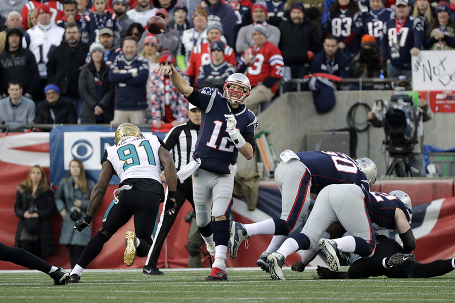 New England Patriots quarterback Tom Brady (12) throws against the Jacksonville Jaguars during the first half of the AFC championship NFL football game, Sunday, Jan. 21, 2018, in Foxborough, Mass.