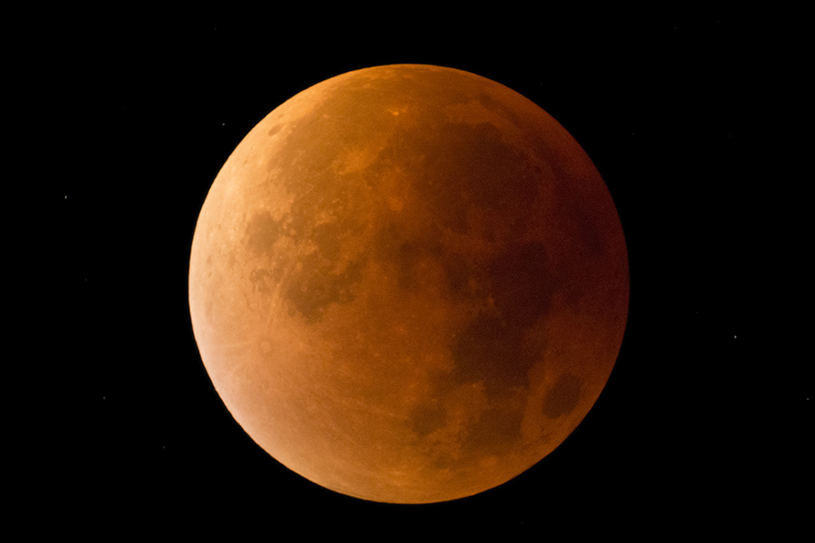 The red, large moon during a total lunar eclipse