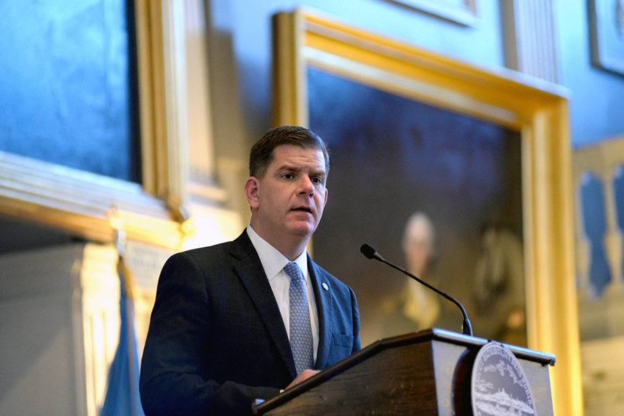 Marty Walsh speaks at a lecturn