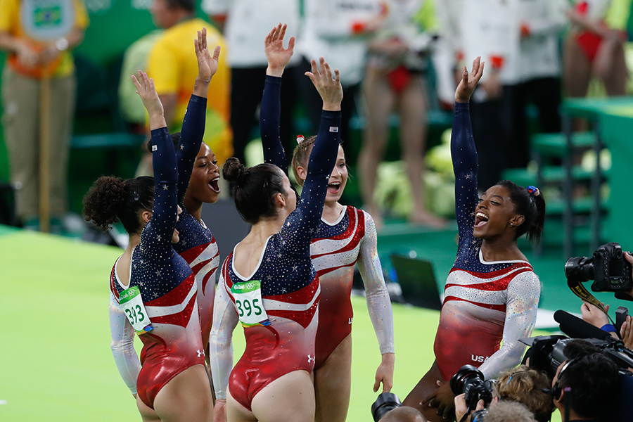 The members of the 2016 U.S. Gymnastics team celebrate in Rio de Janeiro, Brazil