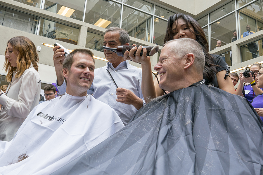 Tom Brady and Charlie Baker getting buzz-cuts