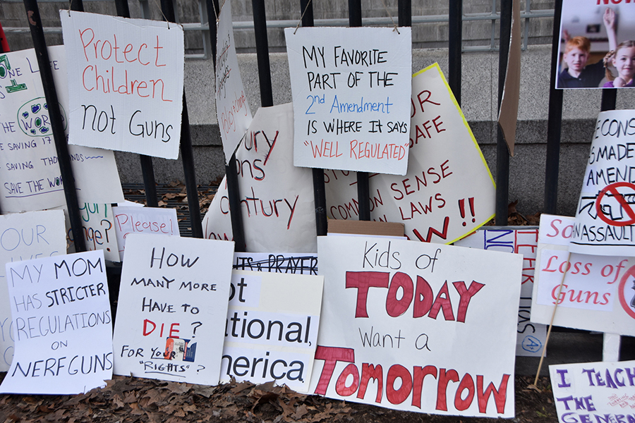 Signs that say "kids of today want a tomorrow" and other messages of gun reform