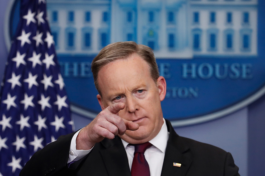Sean Spicer points while standing at the White House Press Secretary's podium