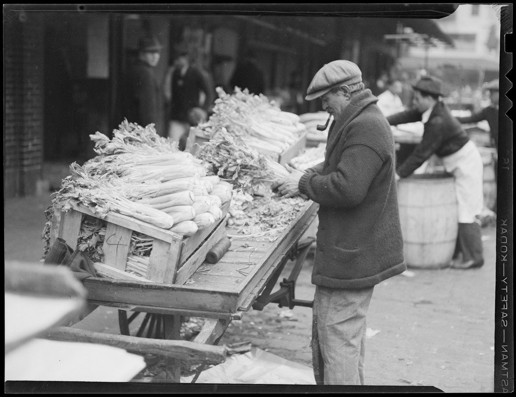 a man at a celery cart at quincy market