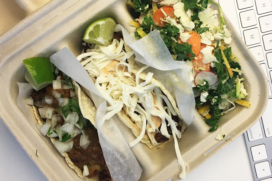 Two tacos and shaved salad to go from the Naco Taco food truck