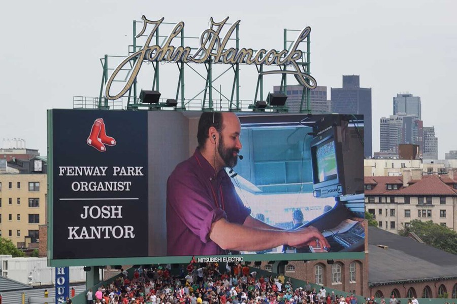 An image of Josh Kantor at the organ is projected on the jumbotron at Fenway Park