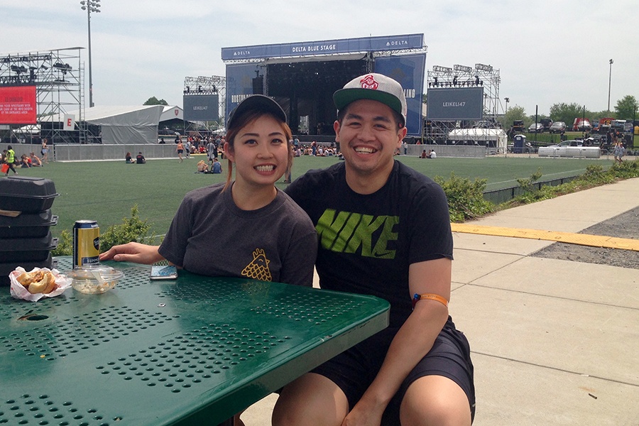 Food vendors Bataan Vo, 27, and Wilson Hui, 29, take a break by the Blue Stage