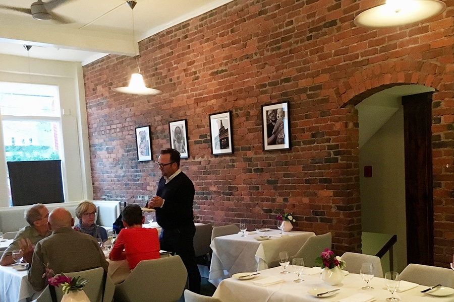 Beverage consultant Matthew Schrage talks with guests in the Talulla dining room.