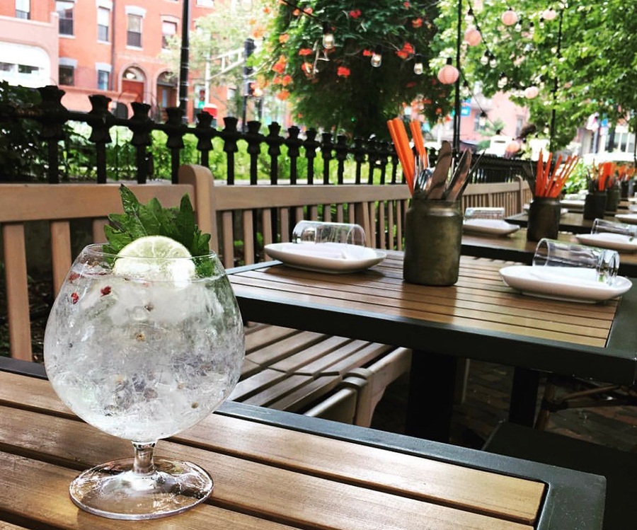 A gin and tonic with shiso on the patio at Banyan Bar + Refuge