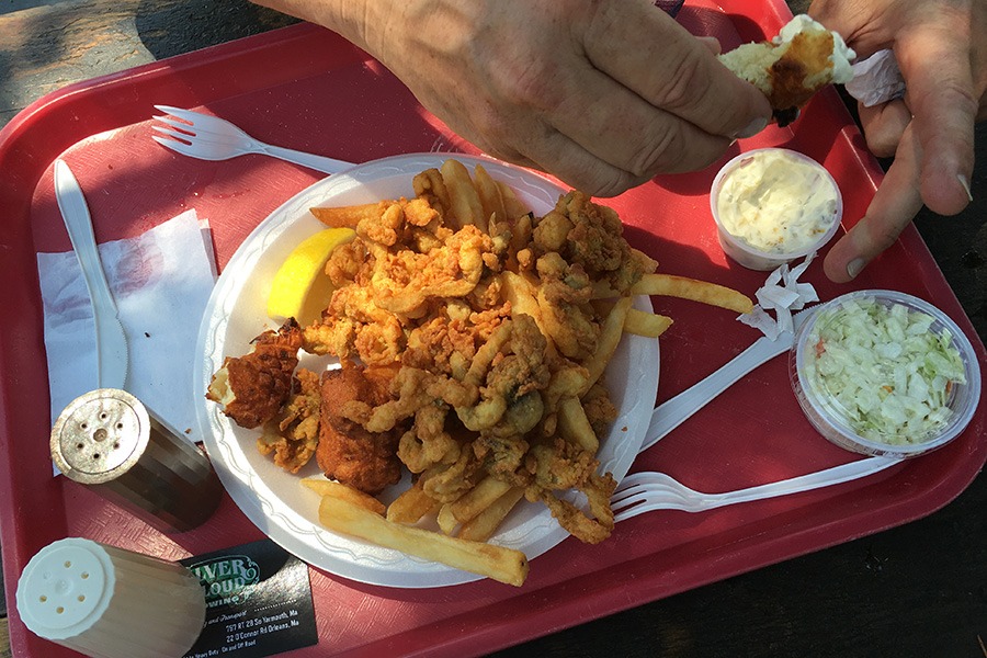 The author's father digs into tartar sauce with a clam cake at Captain Frosty's