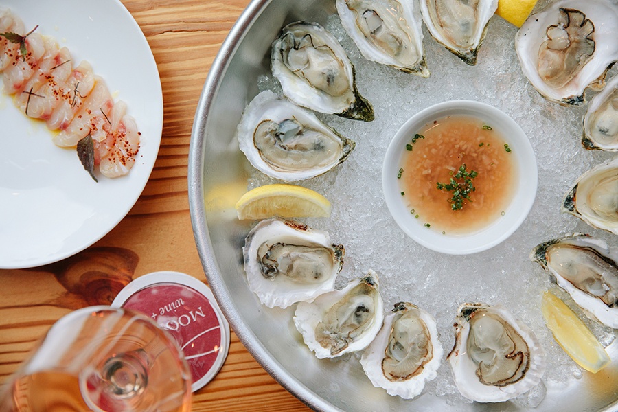East Coast oysters on the half shell, seasonal crudo, more affordable rose options, and more are new to the menu at Moon Bar.