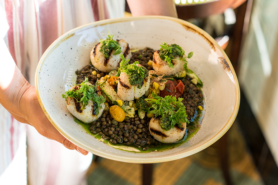 Grilled scallops with le puy lentils are one dish on Explorateur's pre-theater prix-fixe menu.