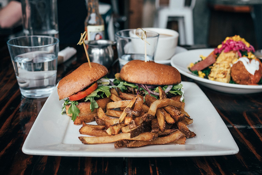 A burger and fries at Rewild Plant Food + Drink