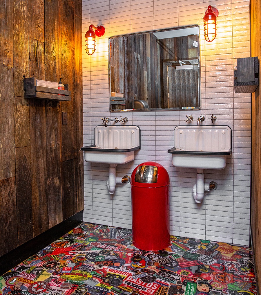 Both men's and women's rooms at Backyard Betty's are covered in a plethora of retro stickers