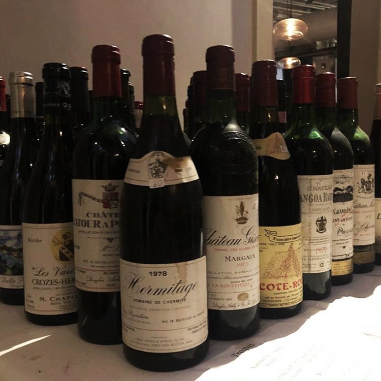 A deeply discounted "Wine Table" is ready for perusal at Troquet on South