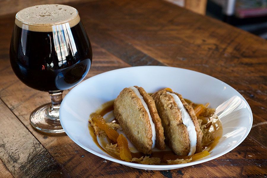 Winter Hill Brewing coconut milk stout "Praxis," paired with an oatmeal cookie sandwich by Littleburg