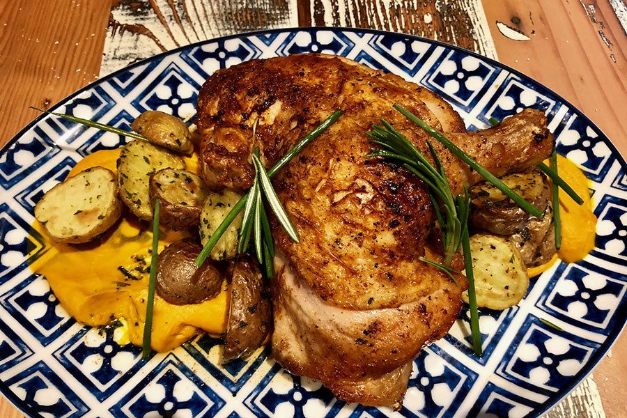 Brick chicken with herb-roasted fingerling potatoes from the Bar Mercato menu