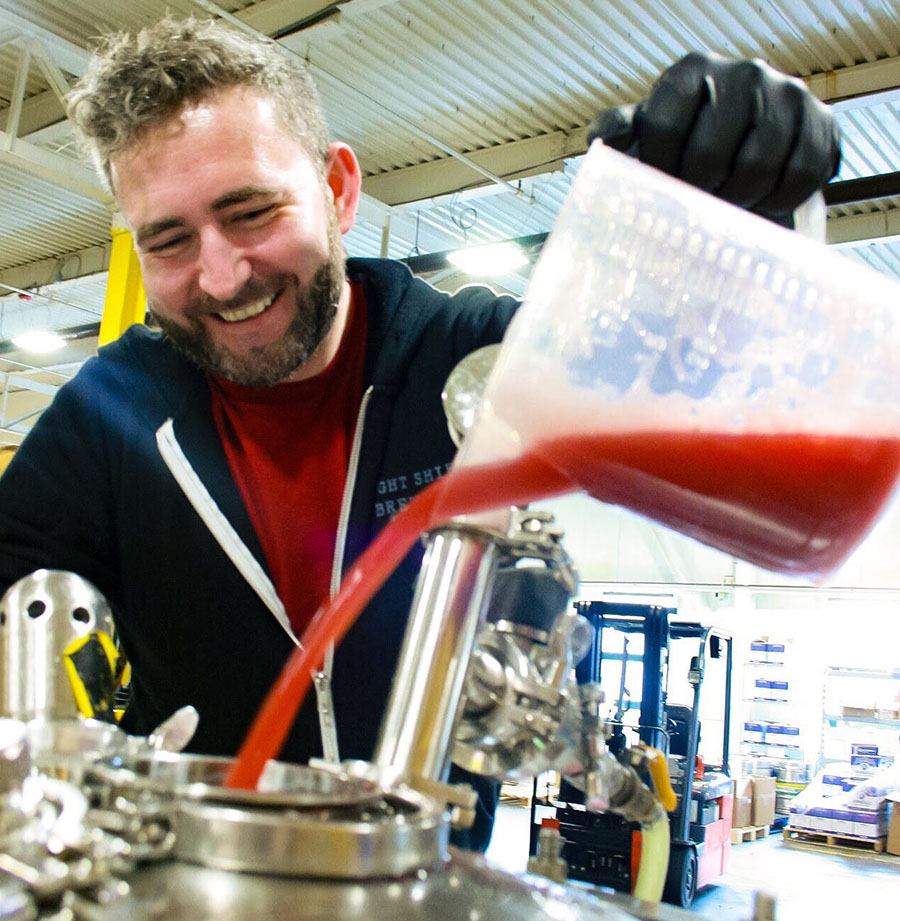 Beat Brew Hall manager Casey Furtaw adds beets to the collaboration beer he made with Springdale