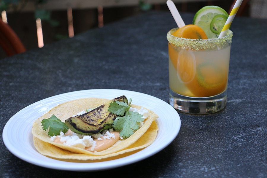A spicy mango jalapeno margarita and a grilled avocado taco from the Poptails menu at Harvest.