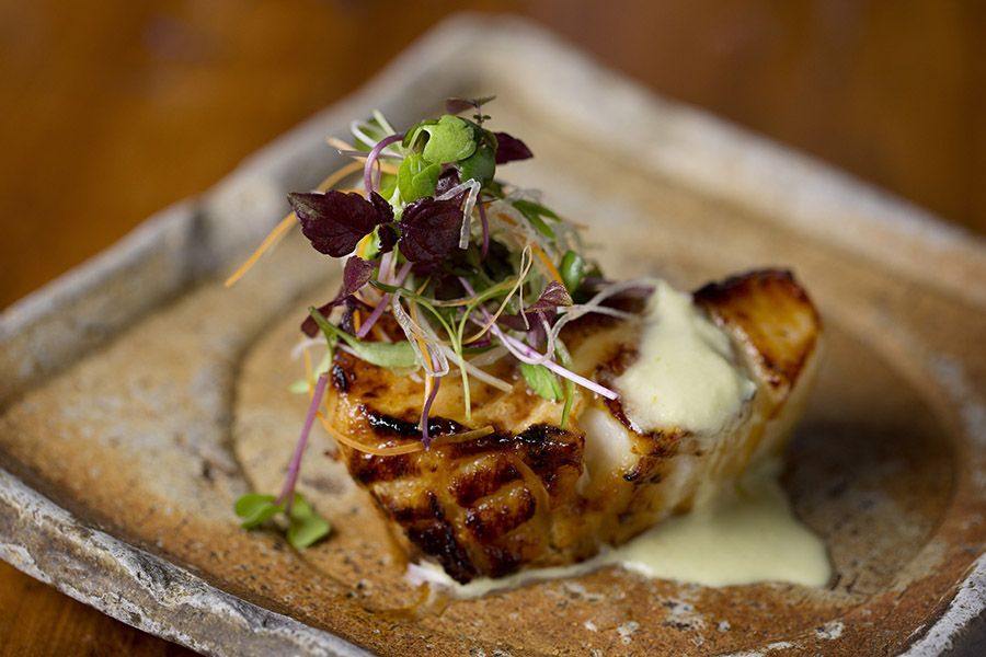 Grilled Chilean sea bass with green chili-ginger dressing at Zuma Boston