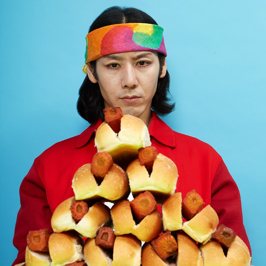 Champion competitive eater Takeru Kobayashi sizing up By Chloe's new carrot dog