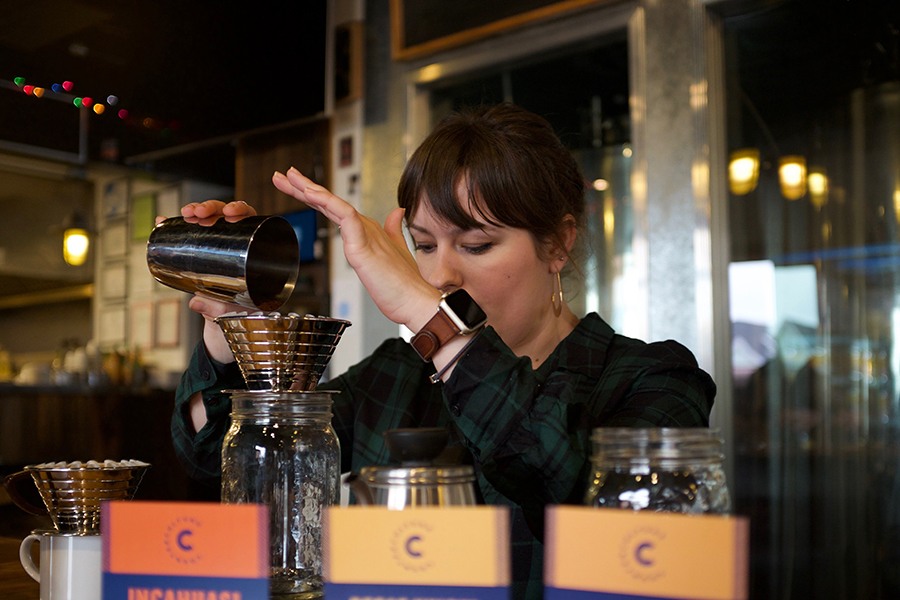 Winter Hill Brewing barista Annie V. makes a Counter Culture pour-over in front of the brewhouse