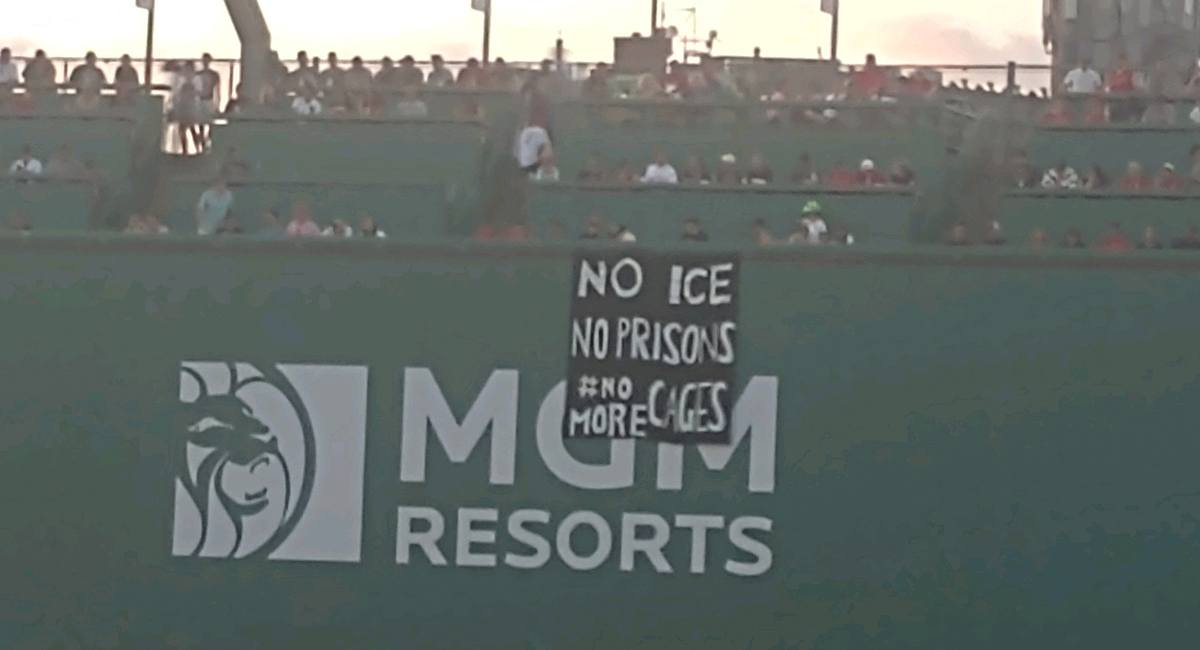 Protestors unfurl 'No ICE, No prisons, No More Cages' banner over