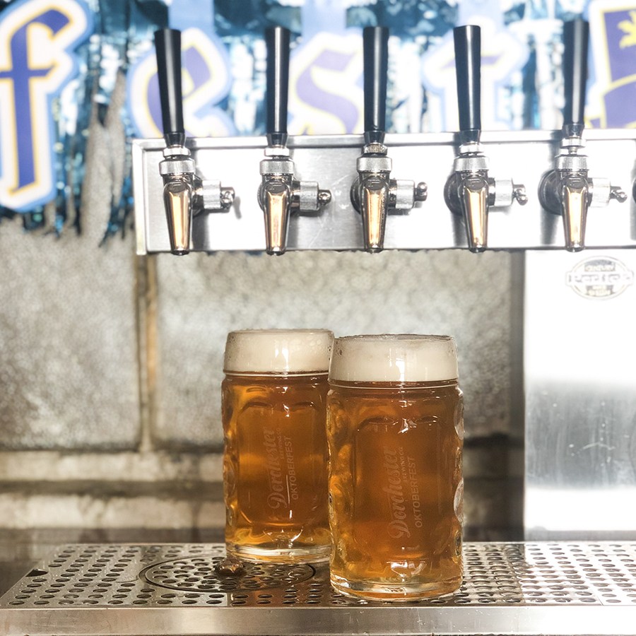 Two Dorchester Brewing Co. steins under the taps for Oktoberfest
