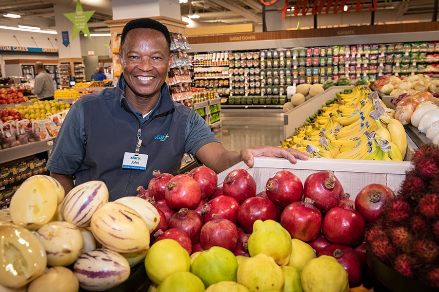 A produce department employee at Star Market at the Hub on Causeway