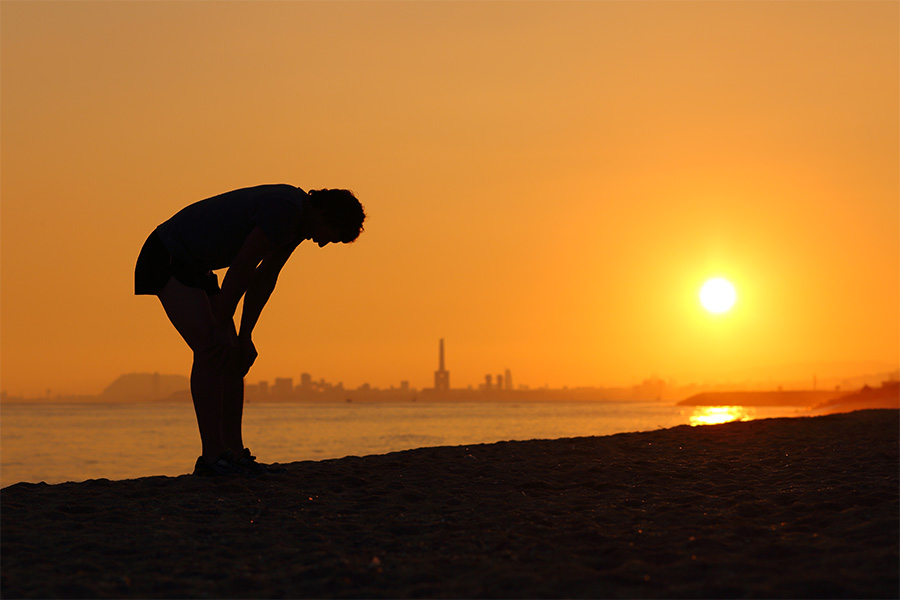 tired runner at sunset