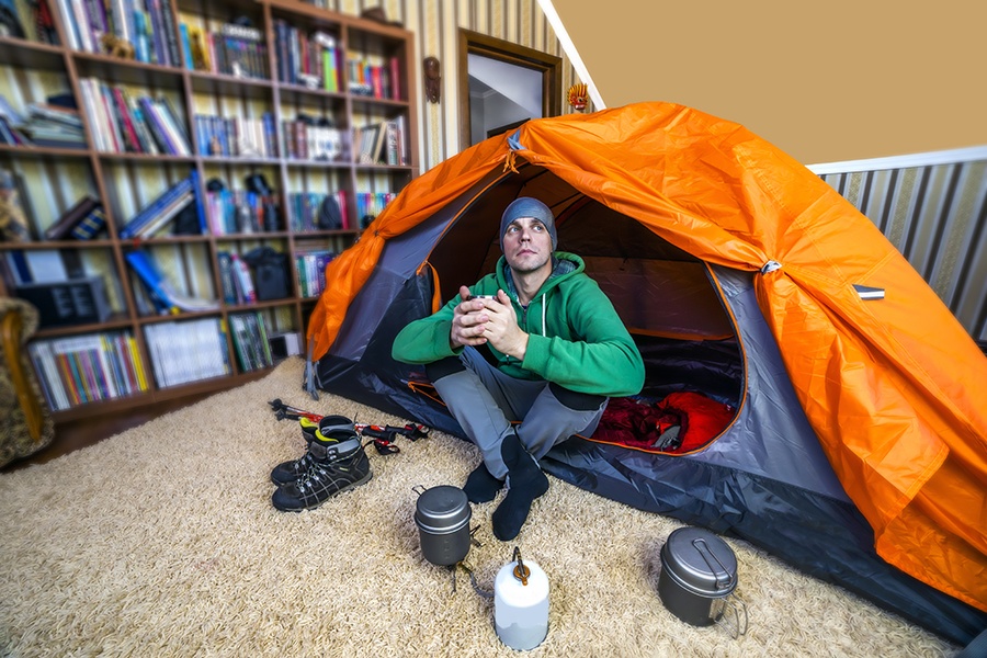 man in tent inside