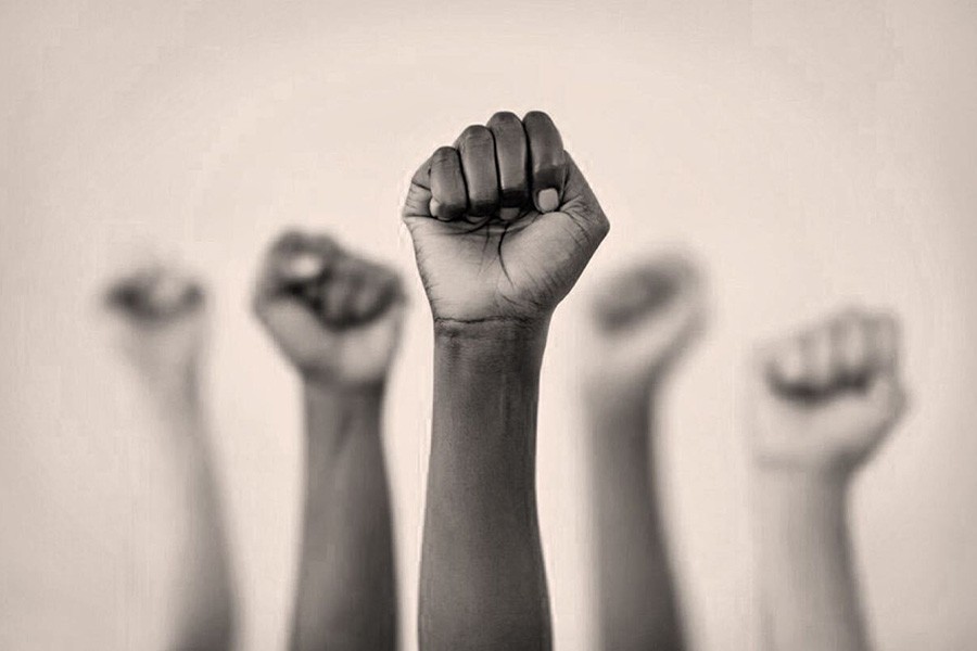 Raised fists image by LaylaBird via Getty from Boston magasine