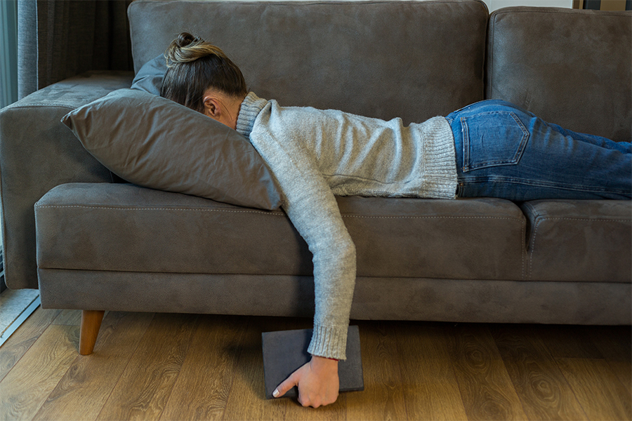 woman facedown on sofa