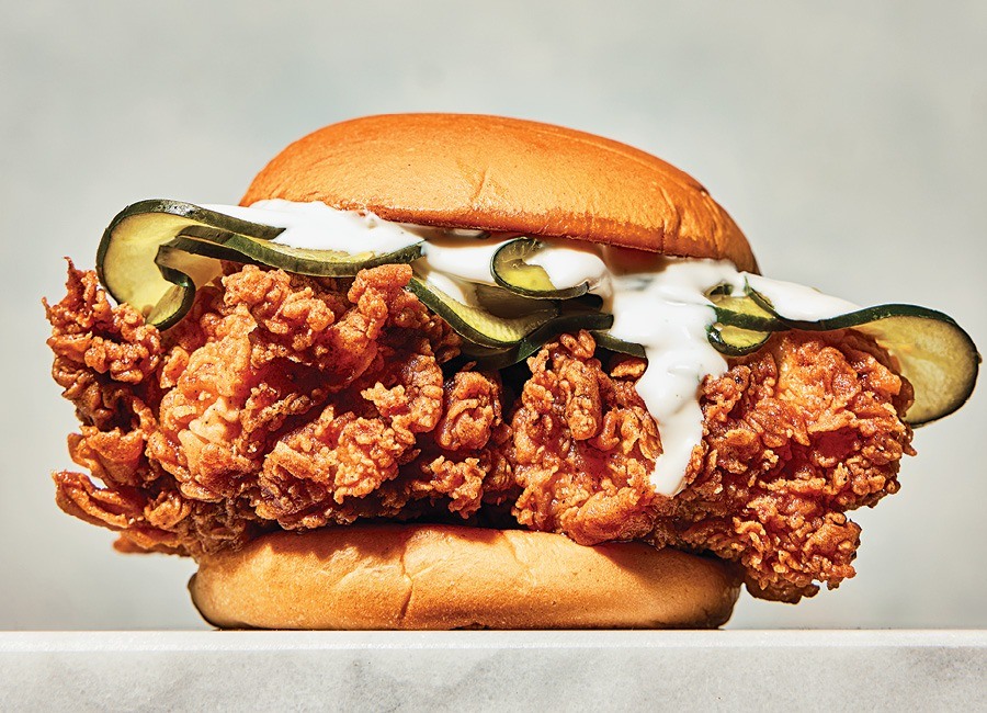 A very crispy fried chicken sandwich, topped with pickles and ranch.