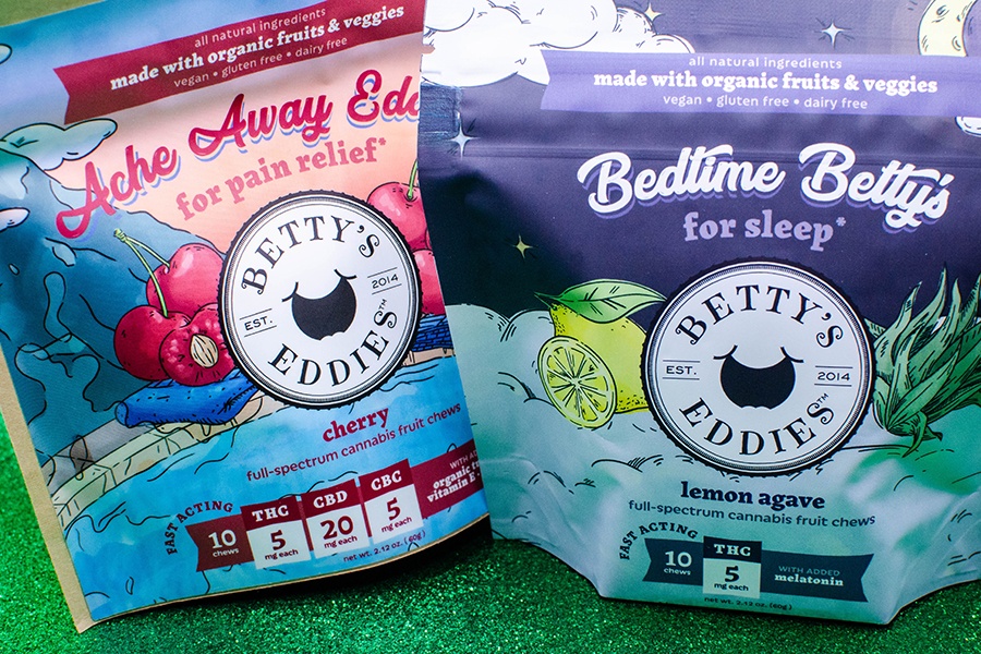 Two packages of cannabis-infused fruit chews feature Betty's Eddies branding.