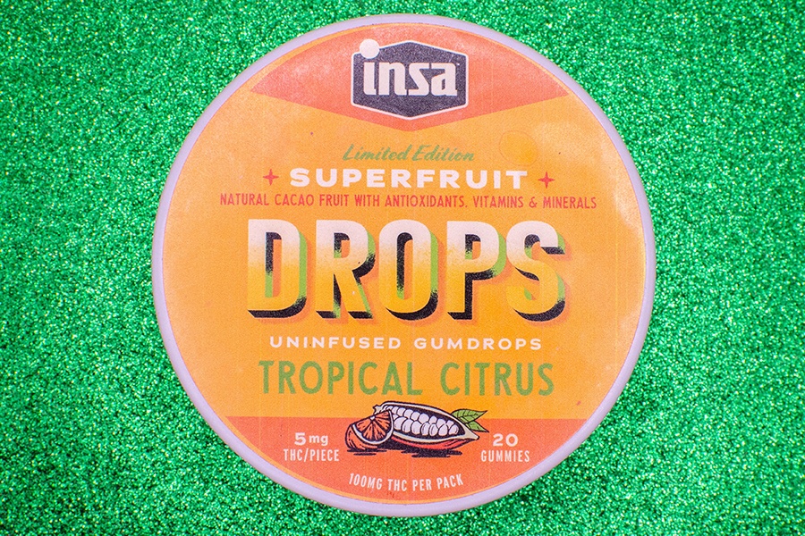 A round orange tin holds citrus gumdrops.
