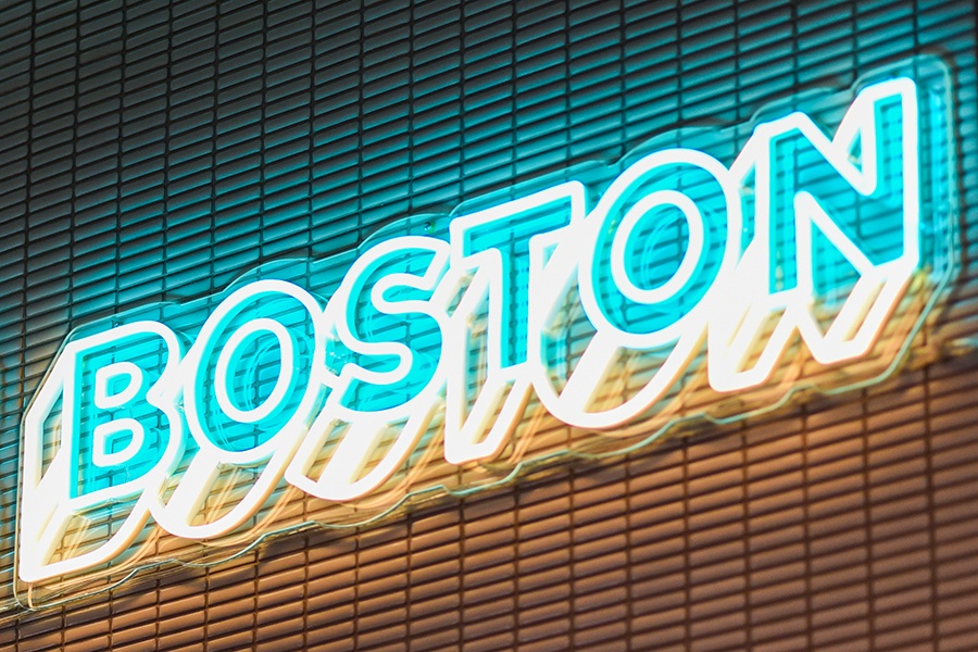 Neon signage reads Boston in capital letters.