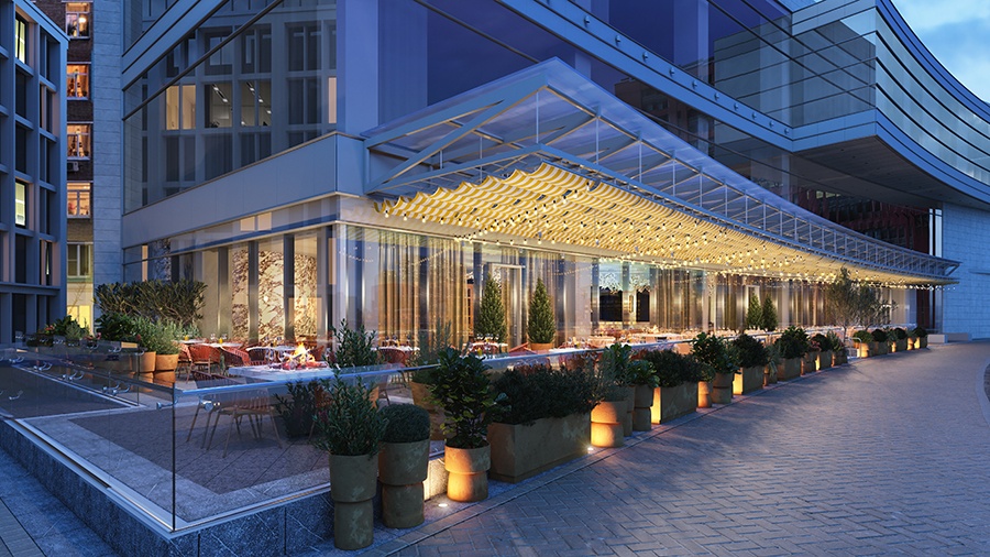 Rendering of a spacious restaurant patio at dusk at the base of a tall city building.