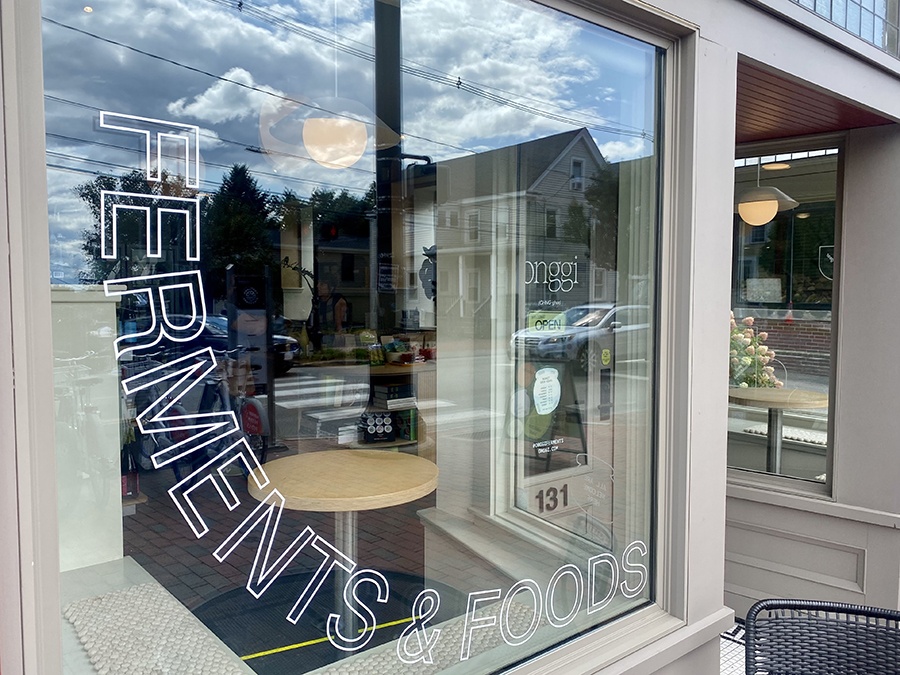 The large front window of a store called Onggi reads "Ferments & Foods."