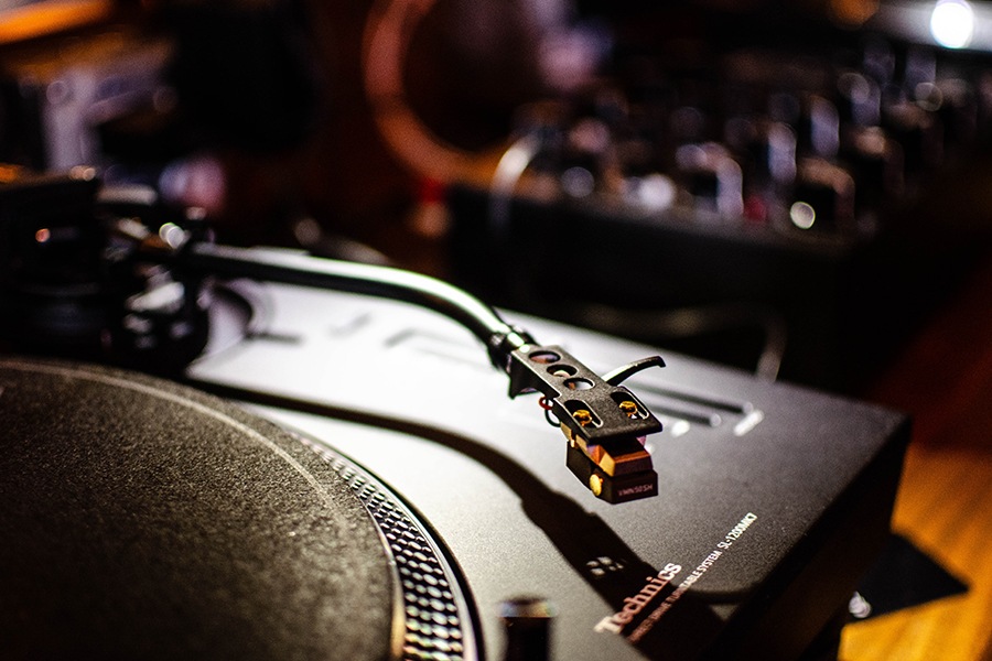 Closeup on a record player and sound board.